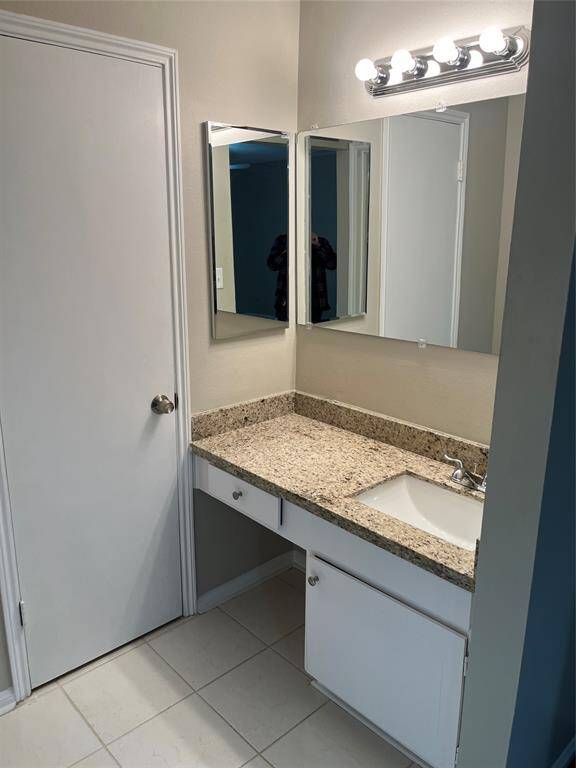 One of two vanities located in primary bath.