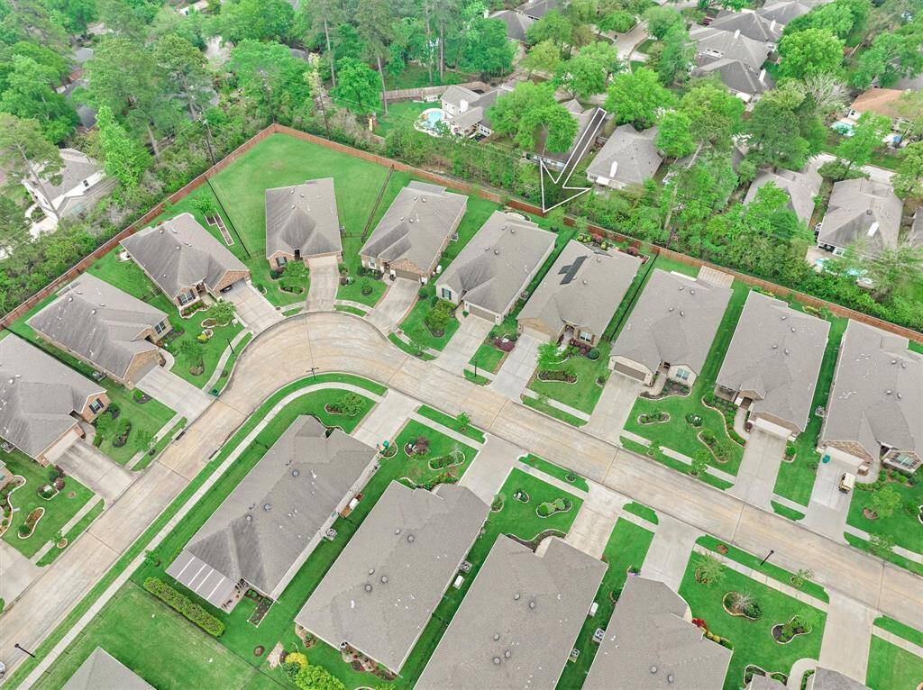 Aerial View of the Home Showing the Trees & Foliage in the Greenbelt behind the home