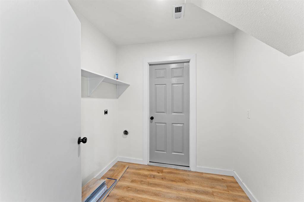 Laundry room downstairs! Great storage space