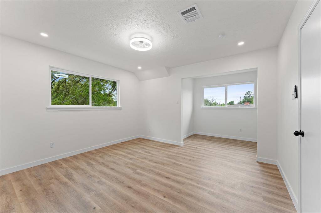 One of the 3 huge secondary bedrooms located upstairs. All of the bedrooms in this home provide bountiful space allowing your interior design creativity to flow!