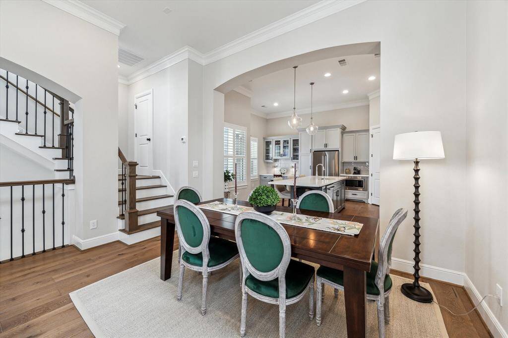 Perfect for effortless entertaining, the dining room is ideally situated between the kitchen and living room. Plus, just up a few stairs, you'll find the conveniently located powder room.