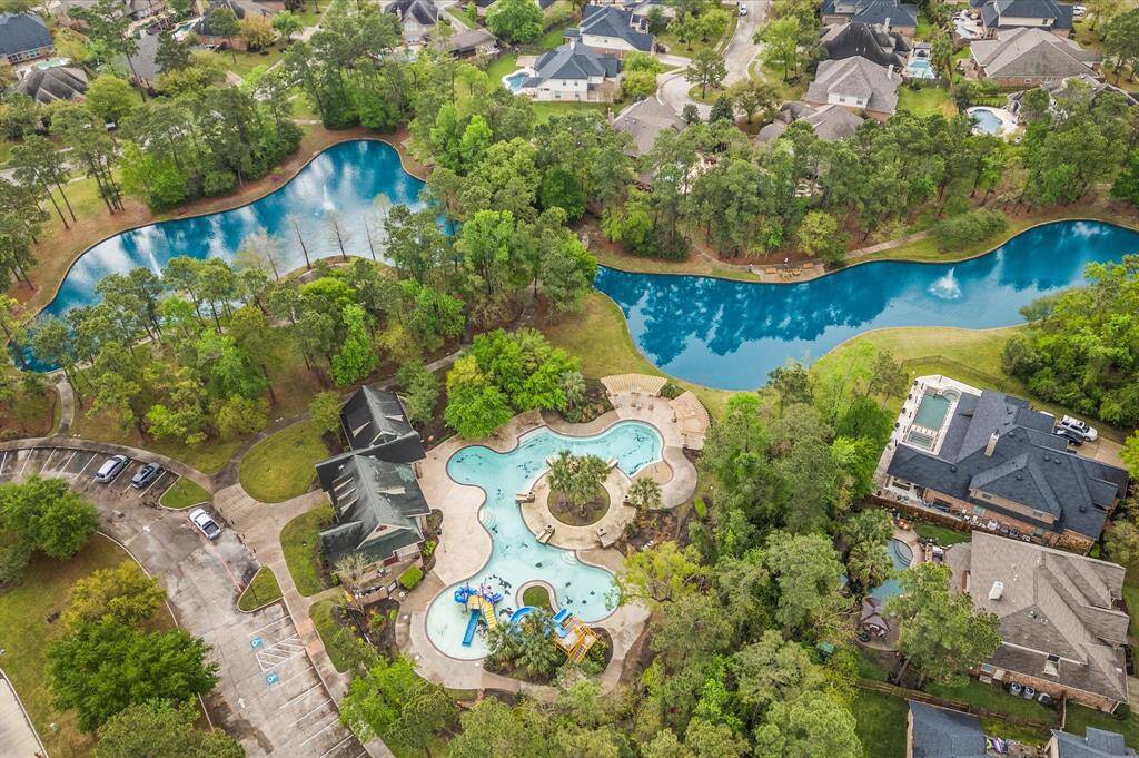 Welcome to your dream home! Located in a beautiful community with mature trees, a breathtaking pool, a serene lake, and scenic walking trails