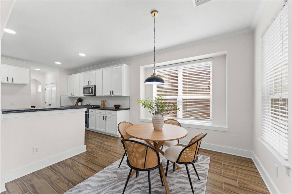 Formal Dining Room – Perfect for entertaining, featuring elegant lighting, upgraded floors
