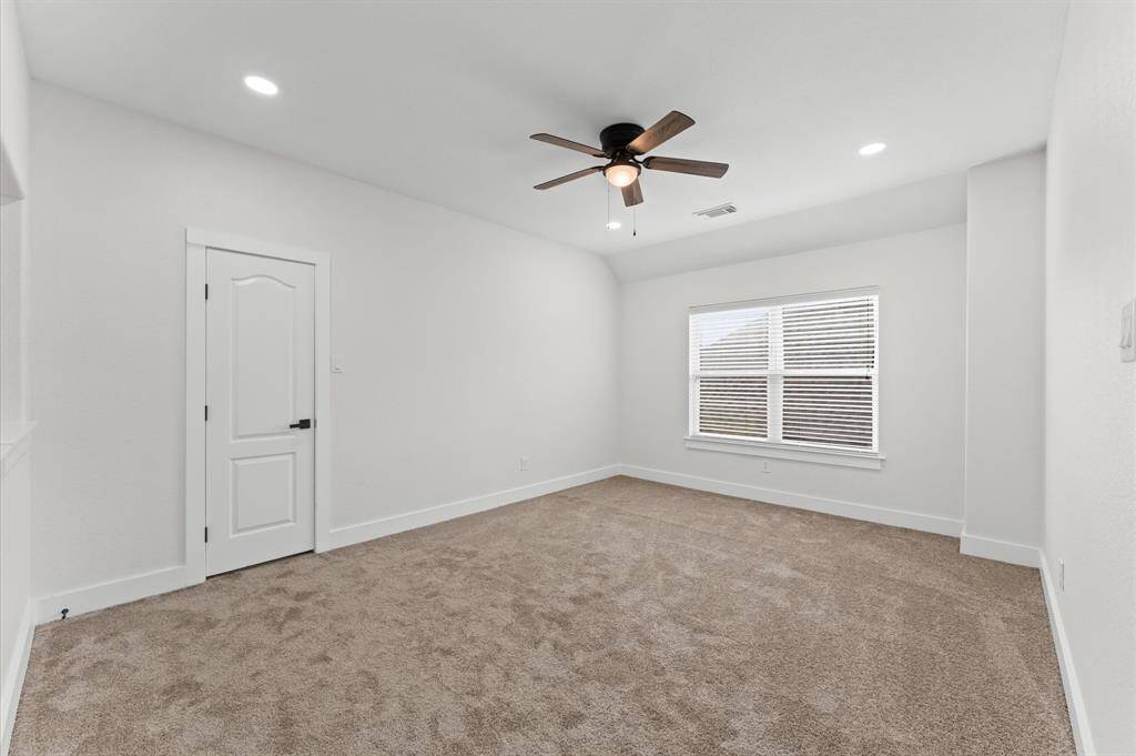 Additional flex space upstairs, ideal for a media room, gym, playroom, or hobby area.