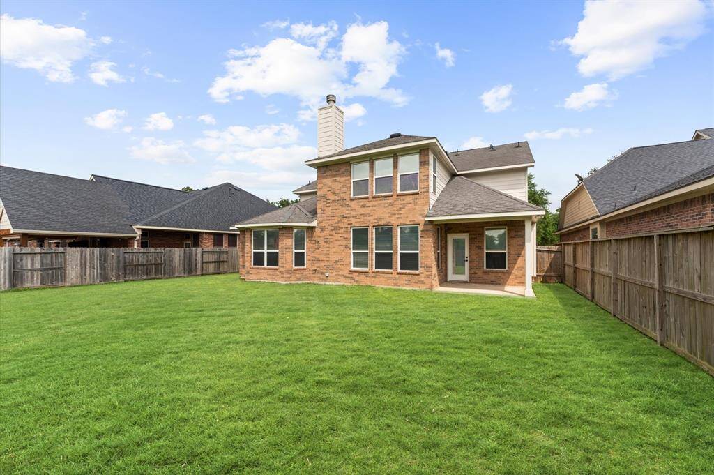 Expansive outdoor area with lush landscaping, no back neighbors, and plenty of space for outdoor entertaining and a pool if needed.