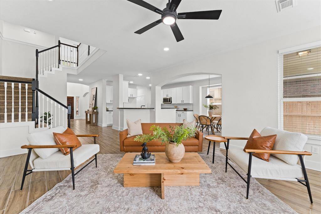 Completely remodeled with white shaker cabinetry, black hardware, quartz countertops, and brand-new stainless-steel appliances, including a 5-burner gas cooktop, Wi-Fi-enabled oven, and dishwasher.