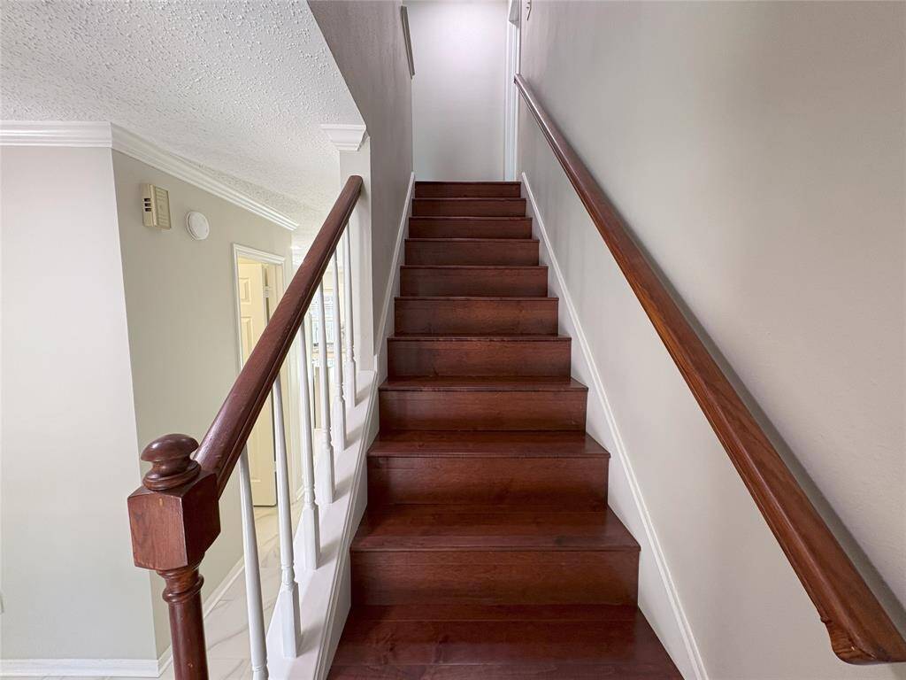 wooden stairs leading to second level