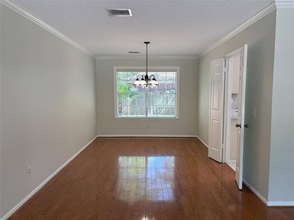 another view of formal dining room with chadelier