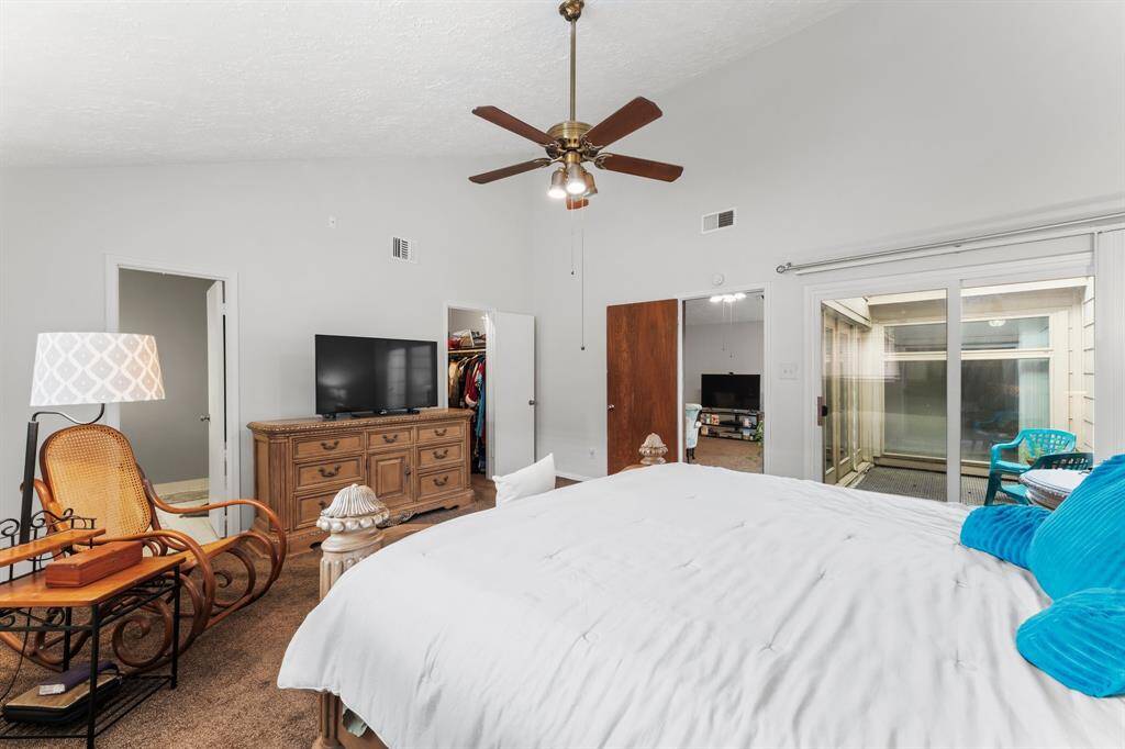 Primary suite retreat featuring direct courtyard access, a spacious walk-in closet, and ensuite bath—designed for comfort, convenience, and a seamless indoor-outdoor flow.