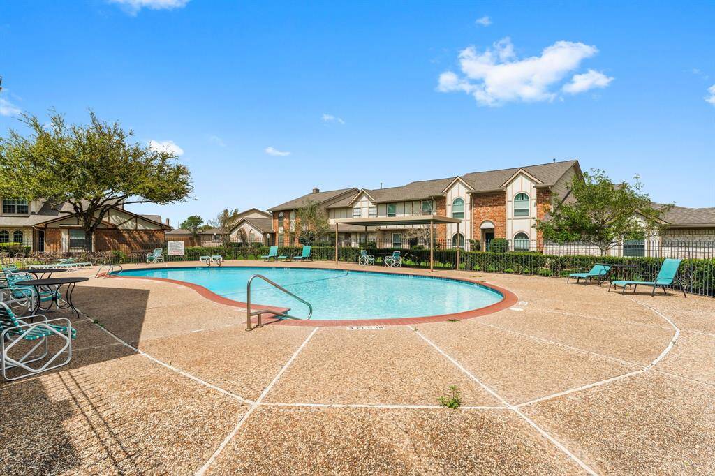 Community perk includes access to a sparkling swimming pool with ample seating—perfect for cooling off, lounging in the sun, and enjoying neighborhood vibes.