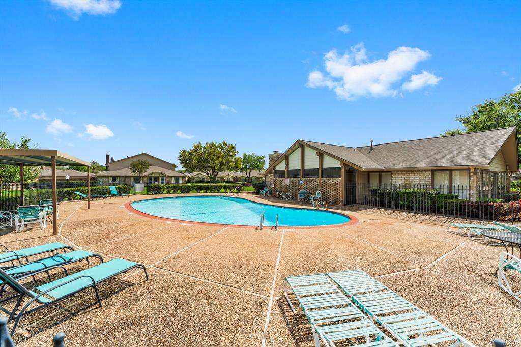 Beautifully maintained community pool area with plenty of lounge chairs, shaded spots, and a tranquil setting—ideal for sunbathing, swimming, or socializing with neighbors.