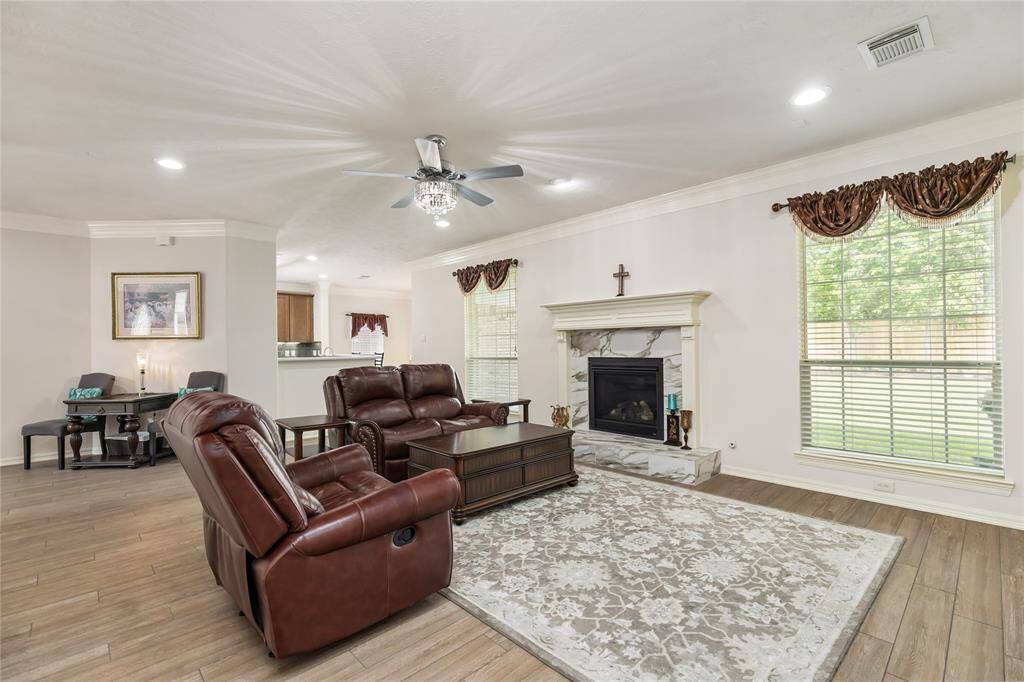 The Living Room's focal point is this beautiful fireplace! Imagine decorating the mantle during the holidays, or gathering around the hearth on chilly evenings.
