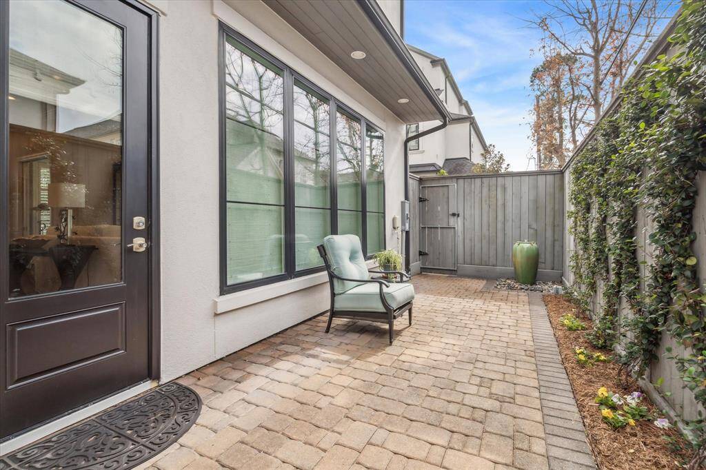 Outdoor patio with pavers and beautiful fountain.