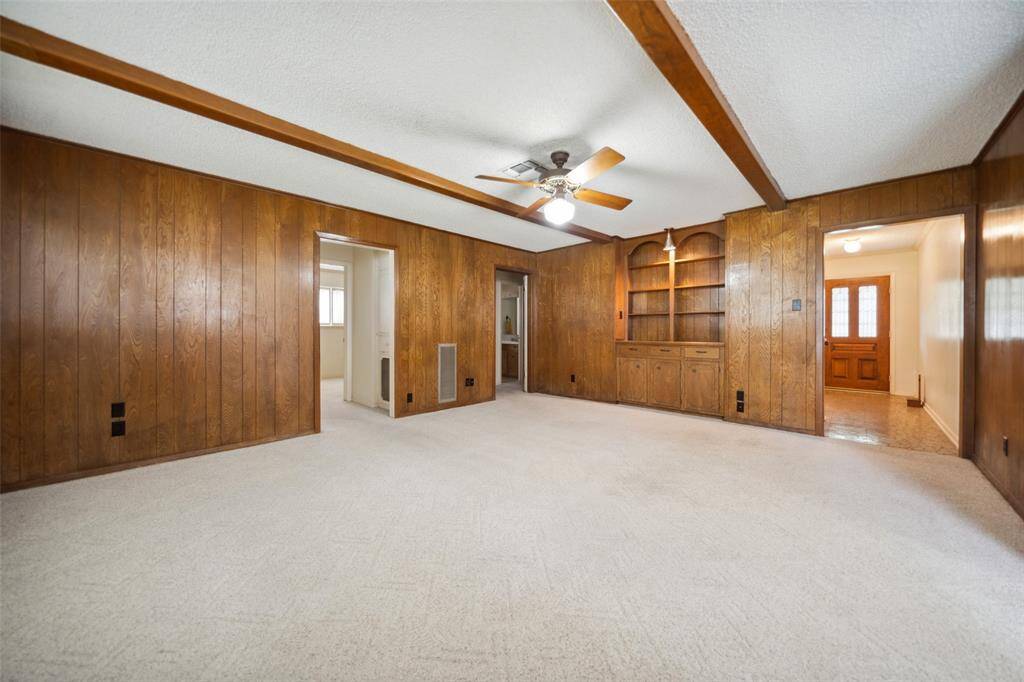 Den with built-ins open to kitchen & dining
