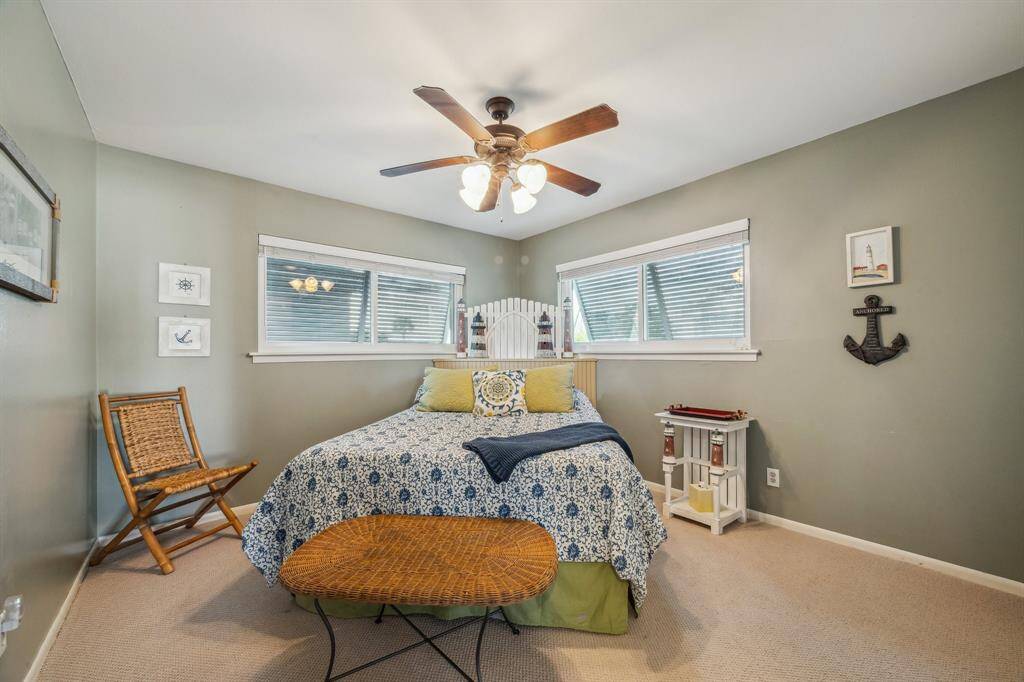This inviting first-floor bedroom offers convenience and comfort.