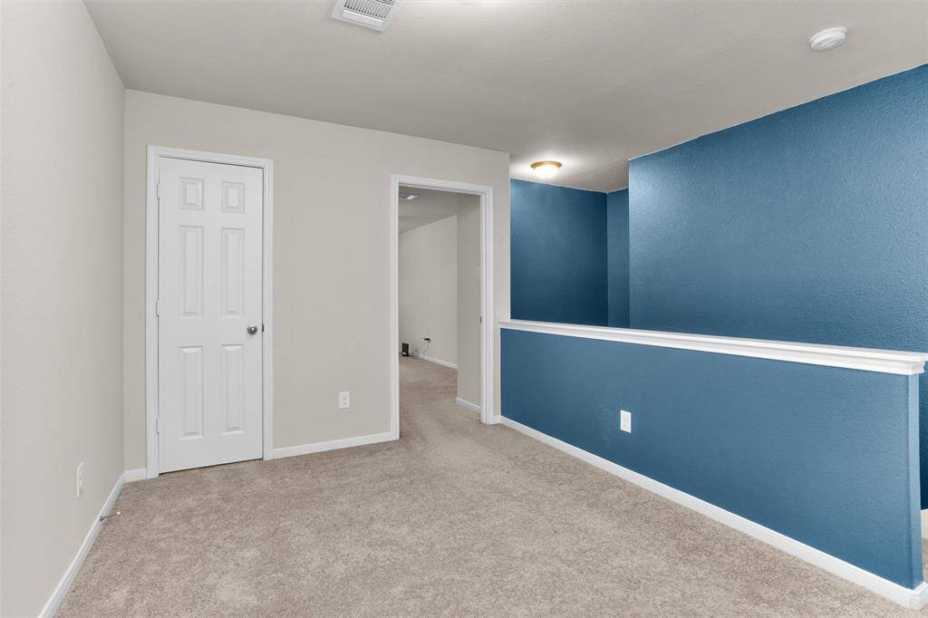 Large primary bedroom viewing the front yard