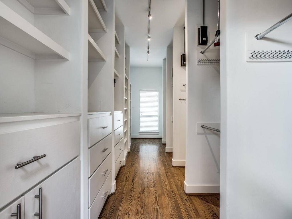 Huge Primary Bedroom Closet with Built-ins and storage.