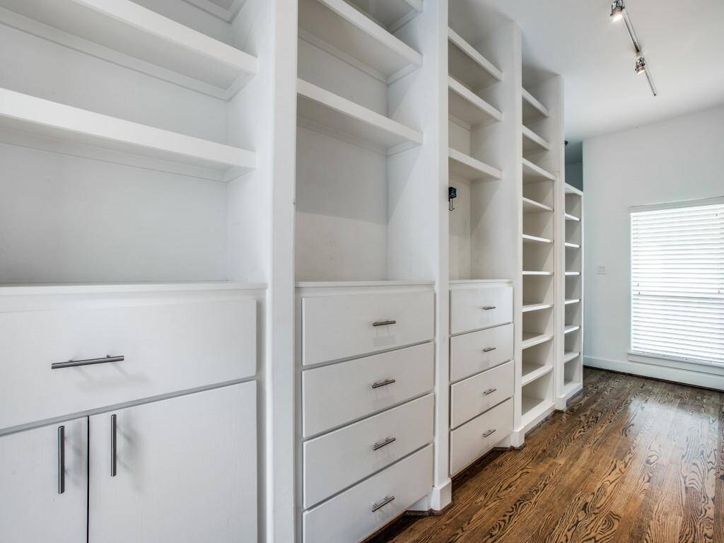 Huge Primary Bedroom Closet with Built-ins and storage.