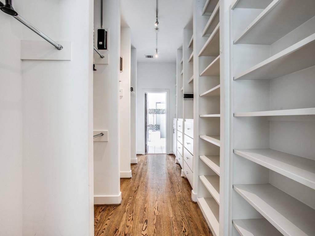 Huge Primary Bedroom Closet with Built-ins and storage.