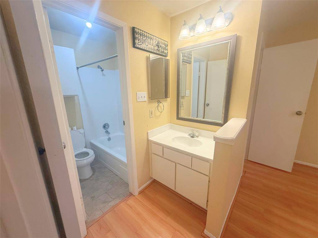 The master bedroom has a separate sink and shower/toilet area.