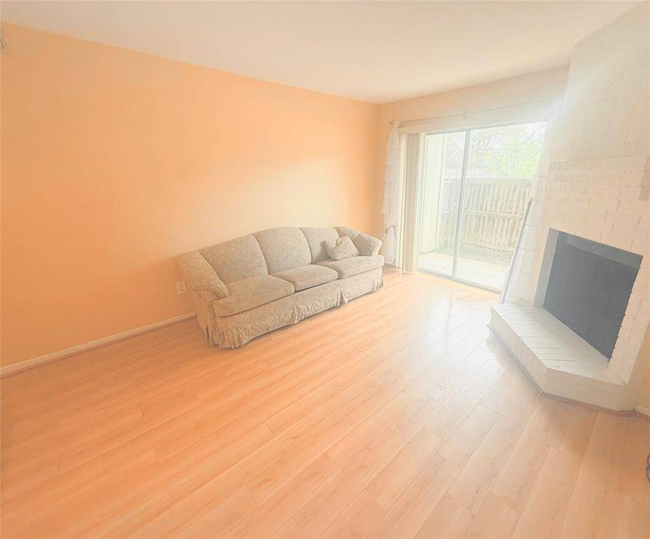 Your living room is warm and inviting, with the connected patio view with additional storage space.
