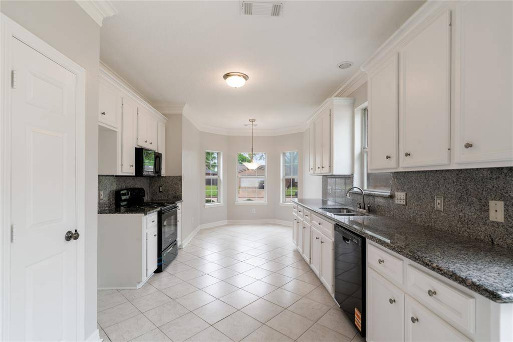 Kitchen with brand new appliances and granite counter tops