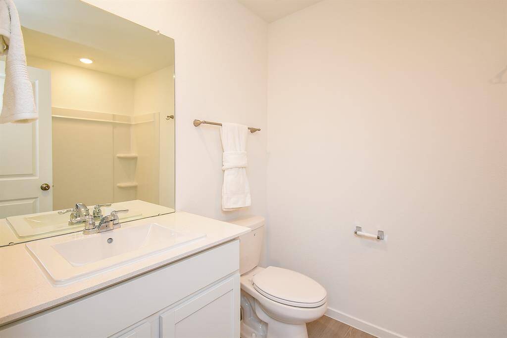 Spacious guest bathroom with plenty of cabinet space for all of your toiletries.