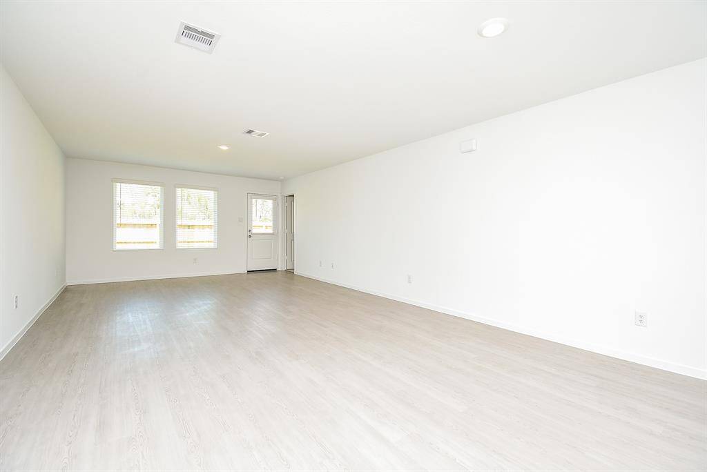 Natural light pours into the livingroom through the wall ofwindows.
