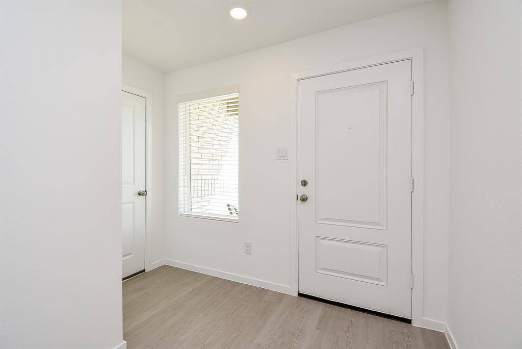 Enter in your new home from either the front door or garage.