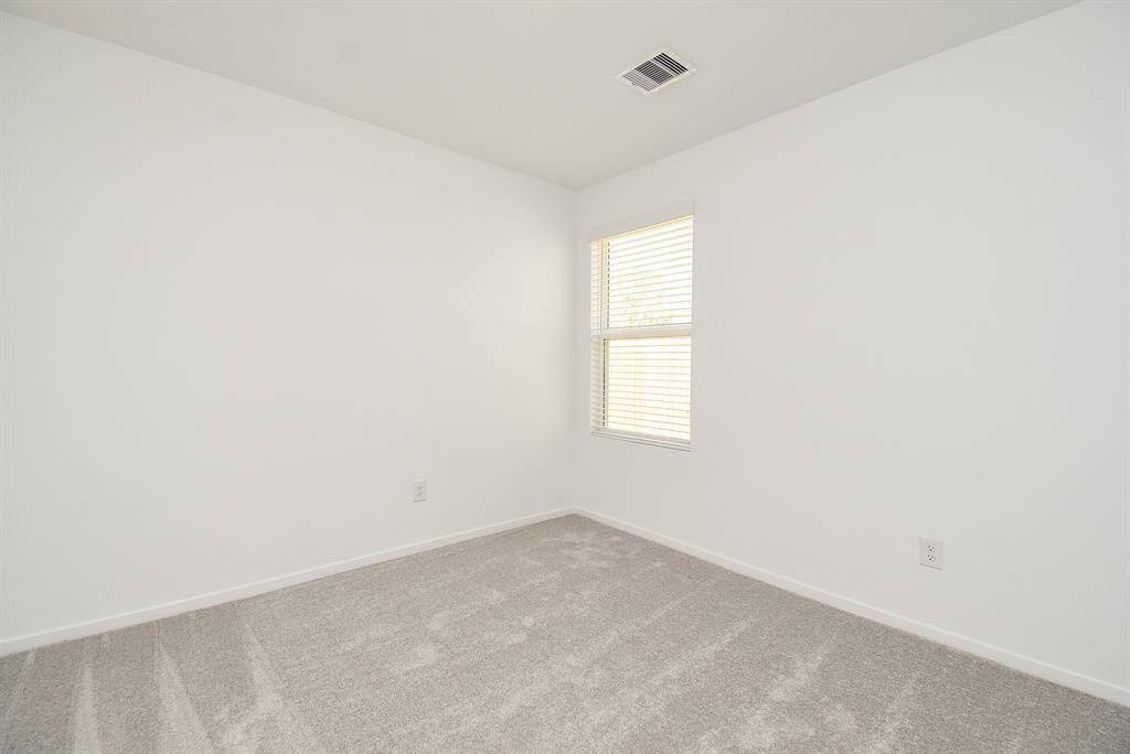 This bedroom makes a perfecthome office space for your workfrom home activities.