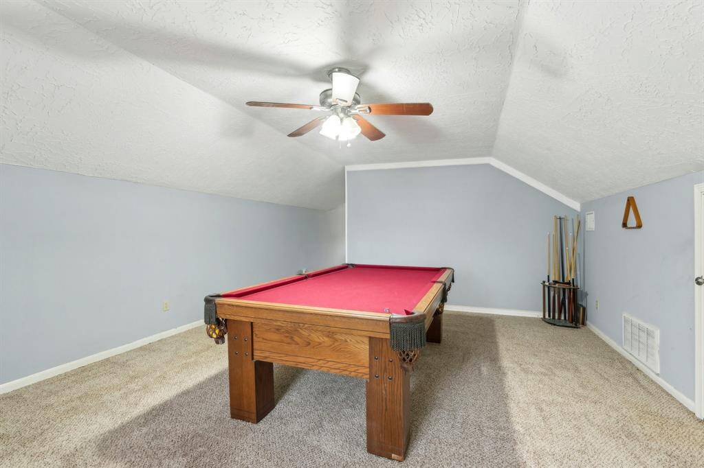 upstairs game room with half bath and walk in closet.  Could be 4th bedroom