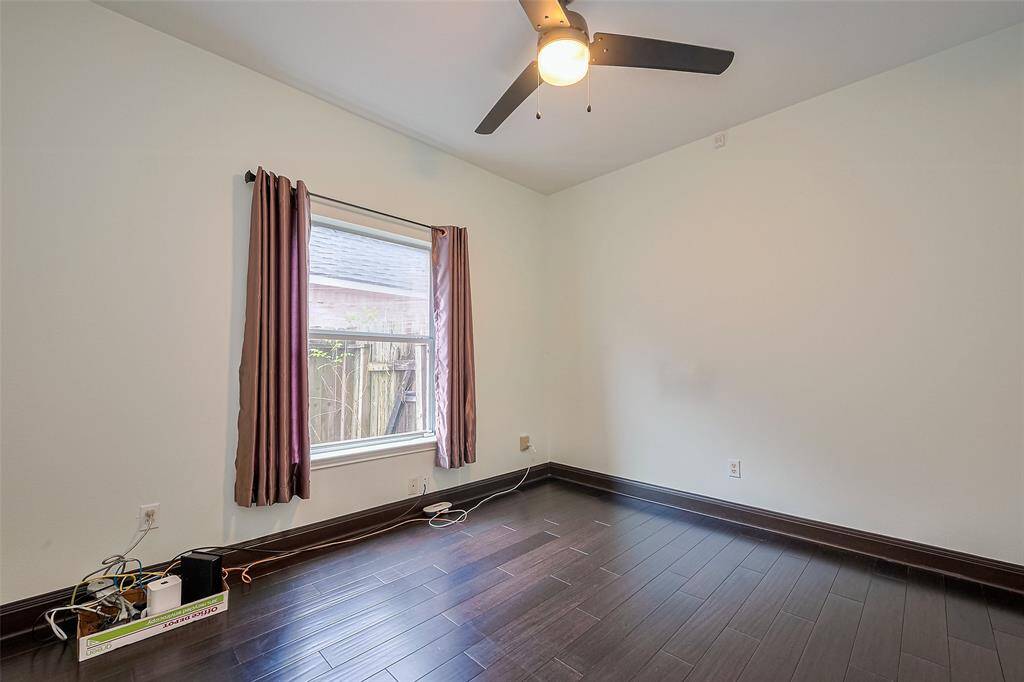 Charming two-story brick home with a spacious double garage and a well-maintained front yard. Features large windows and a covered entryway, providing a welcoming atmosphere. Situated in a peaceful neighborhood with mature trees.