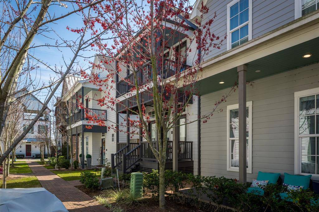 Beautiful tree lined walk way to your front porch.  Garage is attached to the back of the home and has an alley way entry. Your home is the one with two big porches in front !