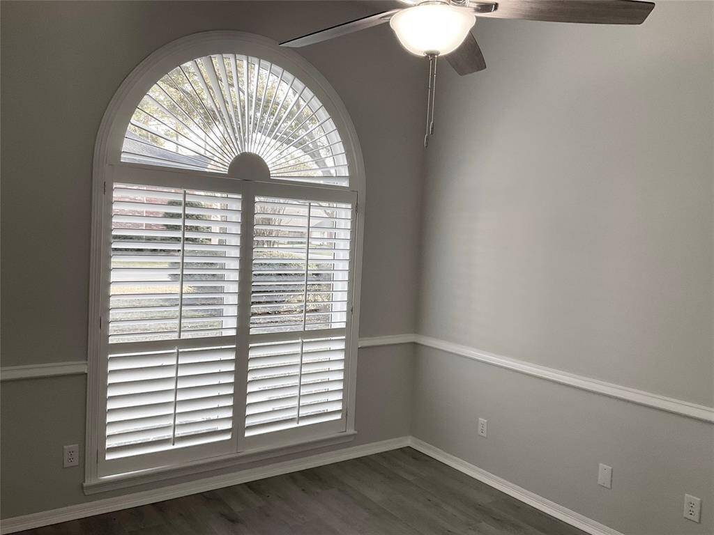 Your study or 4th bedroom with a full bath next door.  A large arched window with elegant white shutters, allowing natural light to view the front yard, kids play or those Amazon deliveries. A very bright and welcoming atmosphere to focus and work from home.