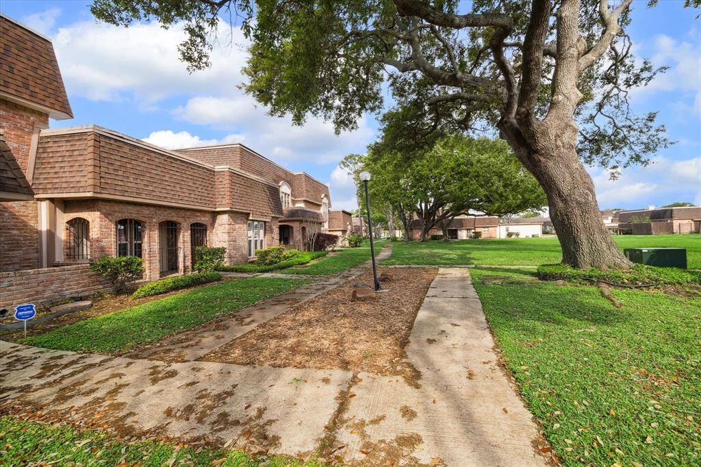 Front of house(on the left side of the light pole)