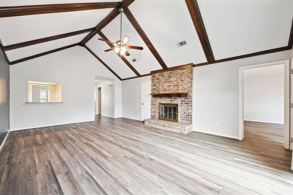 Very large family room has enough room for a breakfast area next the the kitchen bar.