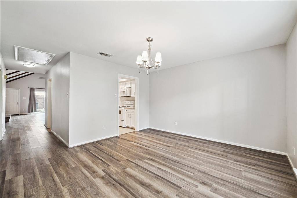 Formal dining room has an entrance to the kitchen.