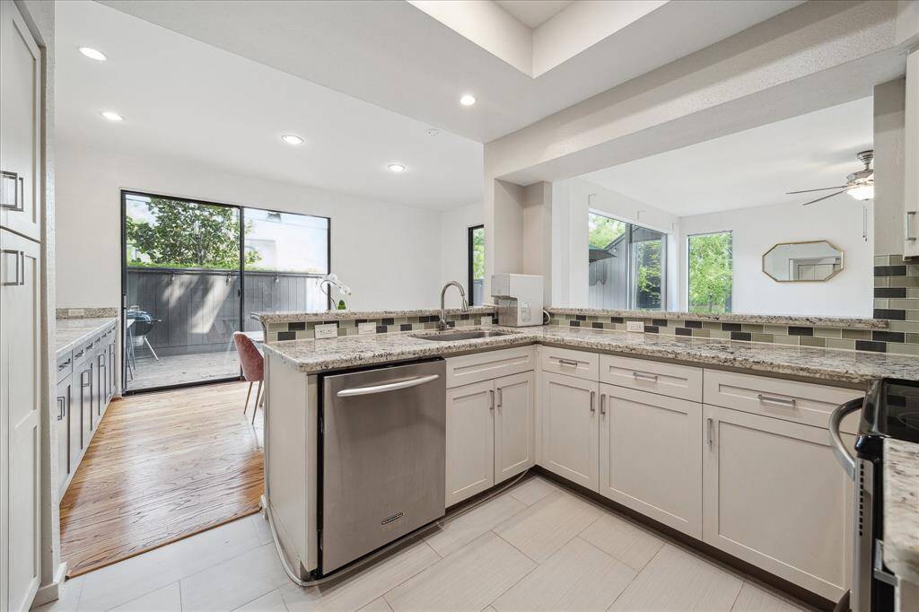 The update kitchen with stainless appliances and granite counters