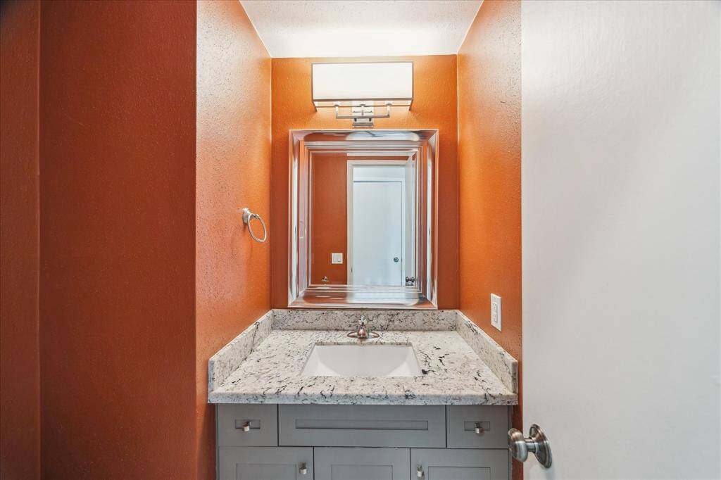 Downstairs powder bath with granite counters