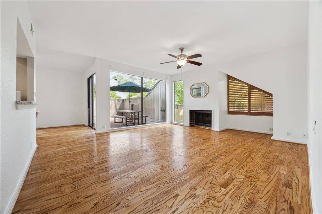 First floor living area with recent refinished hardwoods and wood burning fireplace