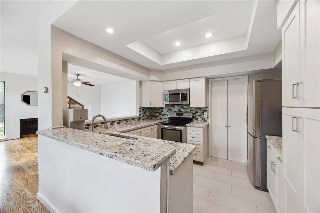 Updated kitchen with granite countertops and stainless appliances
