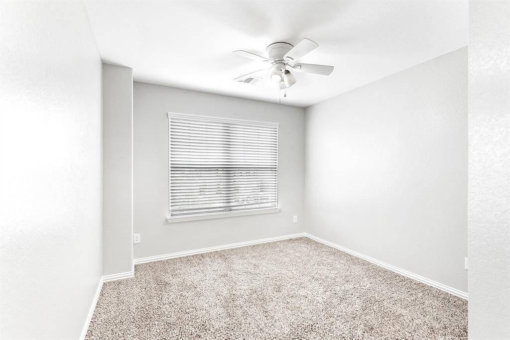 Secondary bedroom painted agreeable grey.