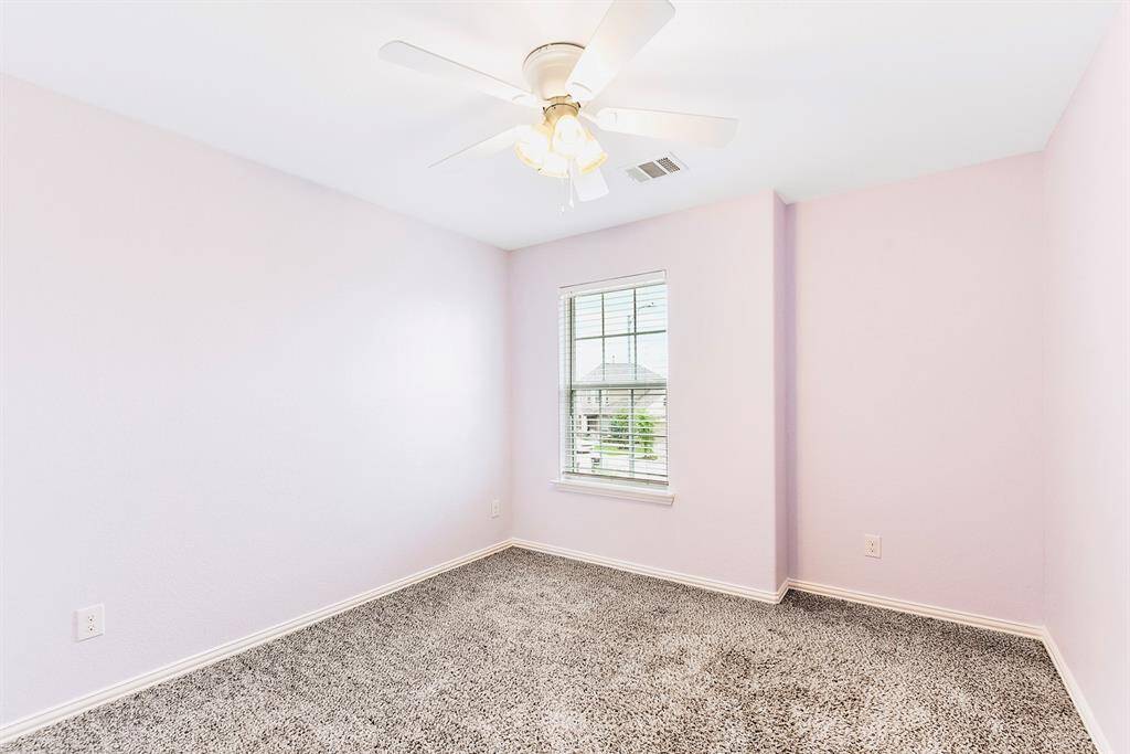 Secondary bedroom is painted Champaigne Lilac (it is not pink, the lighting was off).