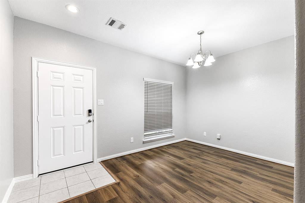 Front door is located in the dining room/home office area.
