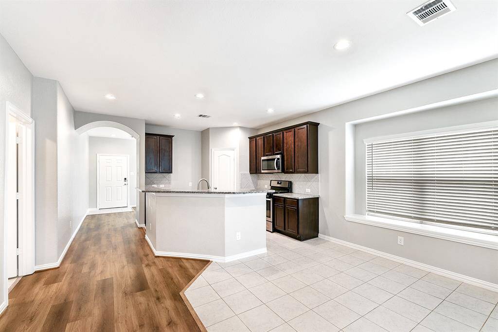 View towards the front door. To the left is the utility room that has garage access.