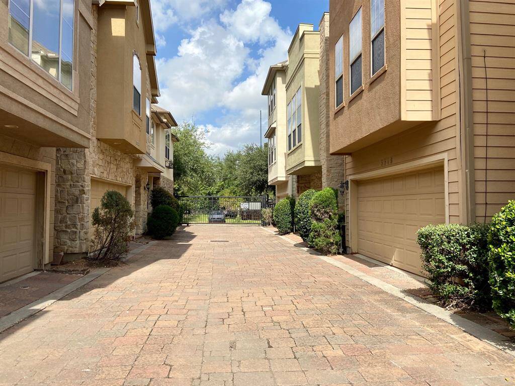 Security gate and cobblestone alleys bring a quaint feeling to this private community.