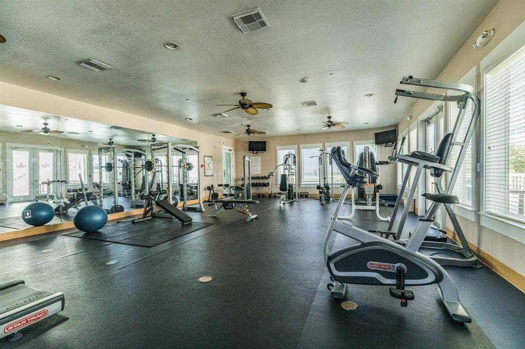 Onsite gym with pool views.