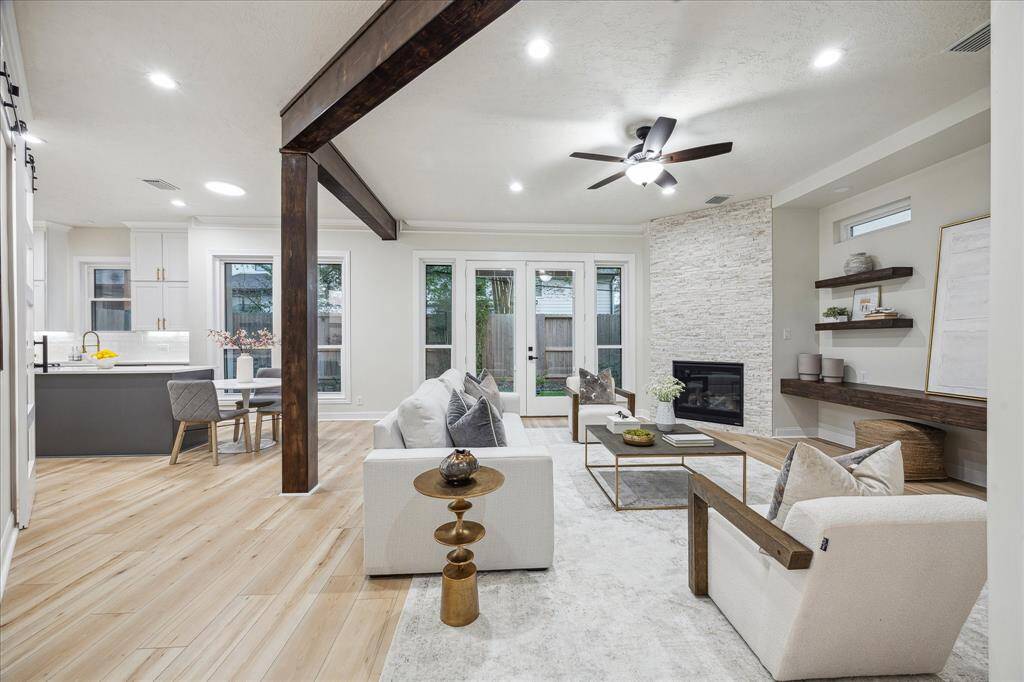 The family room effortlessly flows into the kitchen and breakfast nook, creating an open and inviting space perfect for modern living. With its seamless design, this area encourages easy interaction, making it ideal for both everyday family moments and entertaining guests.