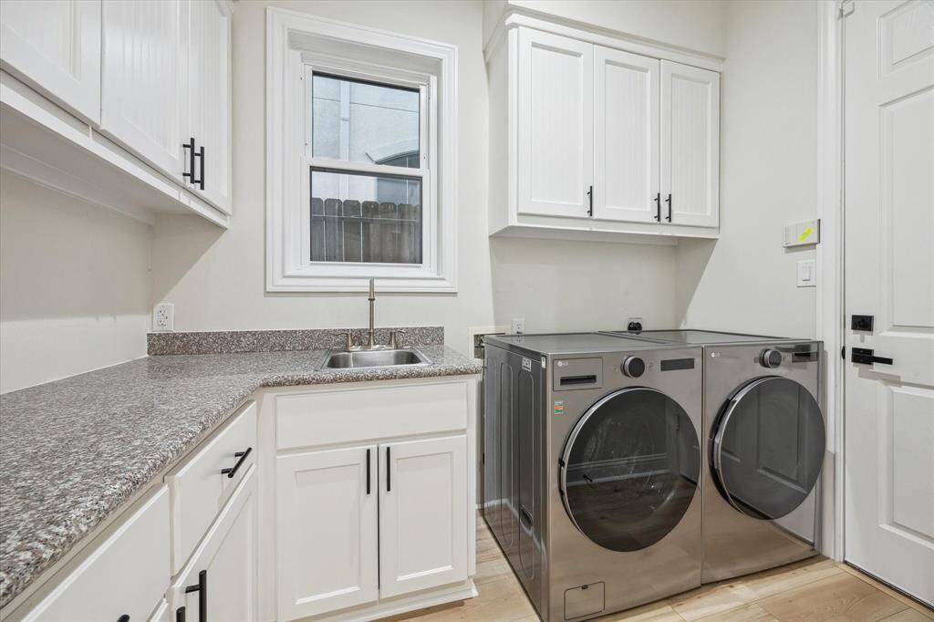 [UTILITY ROOM] The utility room on the first floor offers both convenience and functionality, making everyday chores a breeze. Well-appointed with ample storage space and countertops for folding or organizing, this room is designed to keep things tidy and efficient. Positioned ideally near the main living areas, it provides easy access while keeping laundry and utility tasks out of sight.