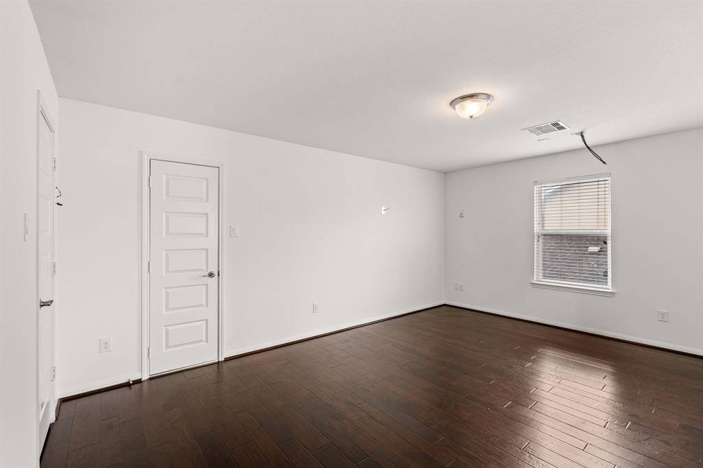 An additional view of the Media Room with two storage closets and additional space for comfortable seating and media equipment. Don't forget the popcorn machine!